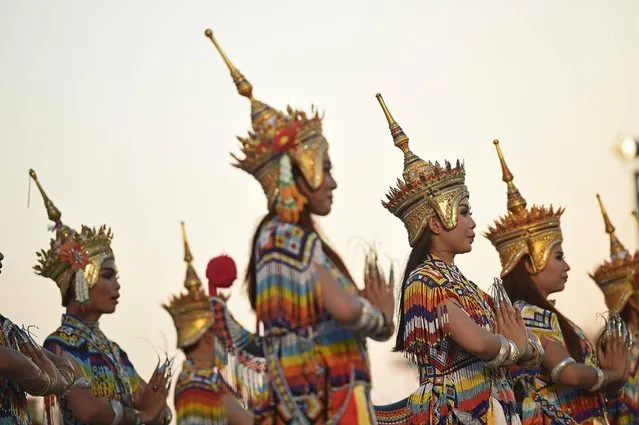 Traditional dancers perform during The 234th Year of Rattanakosin City Under Royal Benevolence event in Bangkok on April 24, 2016. The event celebrates the anniversary of when King Rama I of the current Chakri Dynasty moved the Thai capital from Thonburi to Bangkok on April 21, 1782. (Photo by Lillian Suwanrumpha/AFP Photo)