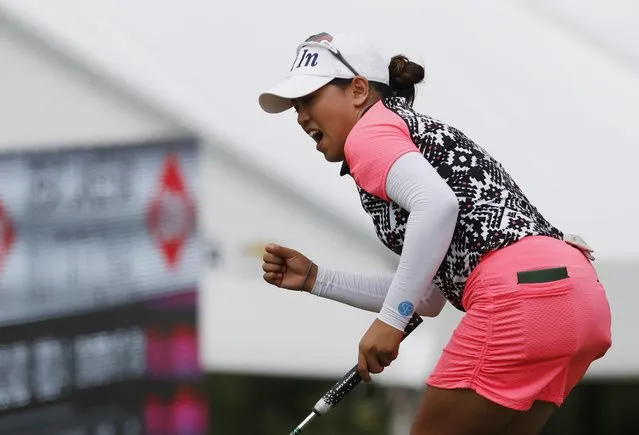 Jasmine Suwannapura reacts after a birdie putt on the 15th green during the final round of the Dow Great Lakes Bay Invitational golf tournament, Saturday, July 20, 2019, in Midland, Mich. (Photo by Carlos Osorio/AP Photo)