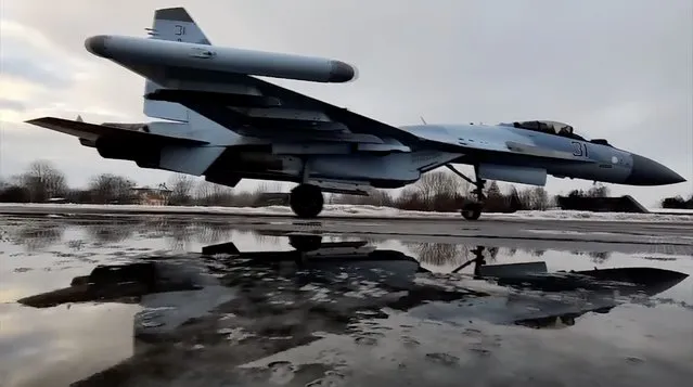 In this photo taken from video and released by the Russian Defense Ministry Press Service on Thursday, January 27, 2022, a Russian Su-35S fighter jets taxies after landing on an airfield in Belarus to attend a Russia-Belarus military drills. Russia has launched a series of military drills: Motorized infantry and artillery units in southwestern Russia practiced firing live ammunition, warplanes in Kaliningrad on the Baltic Sea performed bombing runs, dozens of warships sailed for training exercises in the Black Sea and the Arctic, and Russian fighter jets and paratroopers arrived in Belarus for joint war games. (Photo by Russian Defense Ministry Press Service via AP Photo)