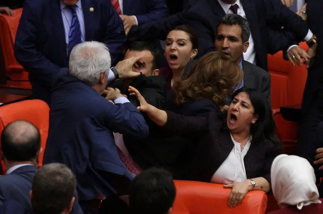 Ruling AK Party and pro-Kurdish Peoples' Democratic Party (HDP) lawmakers scuffle during a debate at the Parliament in Ankara, Turkey late April 27, 2016. (Photo by Reuters/Stringer)