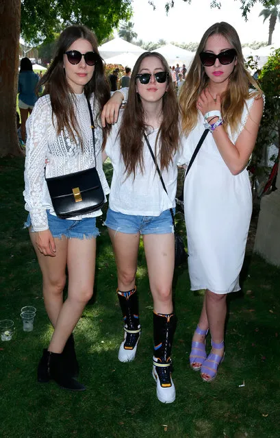 (L-R) Musicians Alana Haim, Danielle Haim and Este Haim attend Day 1 of the LACOSTE Beautiful Desert Pool Party on April 12, 2014 in Thermal, California.  (Photo by Joe Scarnici/Getty Images for LACOSTE)