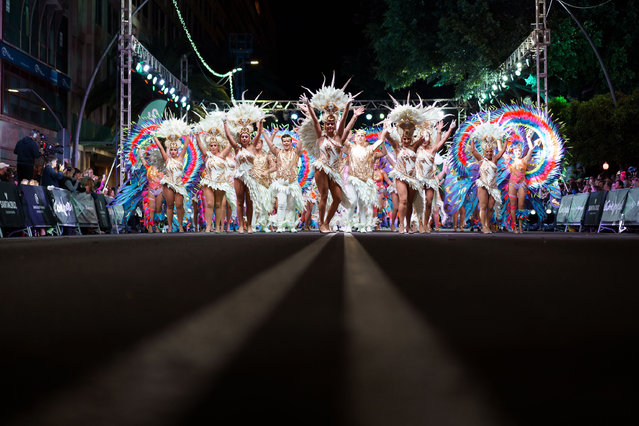 Members of the Rio Orinoco troupe parade during the Rhythm and Harmony contest in Santa Cruz, Tenerife, Spain on February 15, 2023. (Photo by Ramon de la Rocha/EPA)