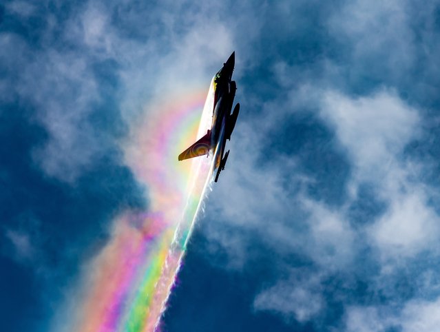 The picture dated March 18, 2024 shows the iconic Typhoon creating a vapour rainbow in the sky as it practises for this season's airshows. The 2024 display pilot Flt Lt David “Turbo” Turnball was seen putting the Typhoon through its paces in the skies over RAF Coningsby in Lincolnshire. (Photo by Caroline Haycock/Bav Media)
