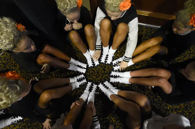 A dance group have a team meeting before performing on stage in the under 13's category during the World Irish Dancing Championships in Dublin, Ireland on April 11, 2017. (Photo by Clodagh Kilcoyne/Reuters)