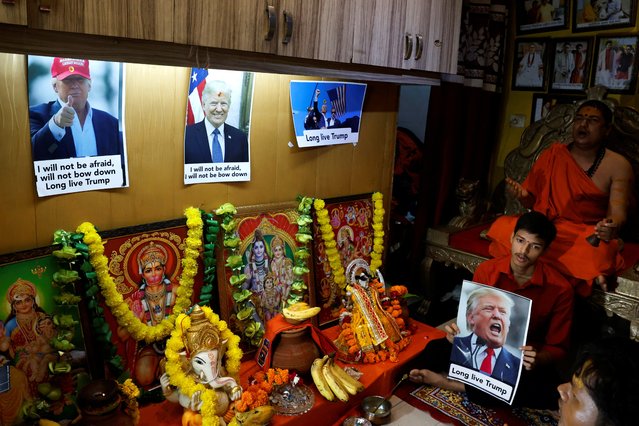 Activists from Hindu Sena, a Hindu right-wing group, perform a special prayer for the longevity of Republican presidential nominee and former U.S. President Donald Trump after he survived an assassination attempt, in New Delhi, India, on July 16, 2024. (Photo by Priyanshu Singh/Reuters)