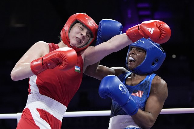 Uzbekistan's Navbakhor Khamidova, left, fights United States' Morelle Mccane in their women's 66kg preliminary boxing match at the 2024 Summer Olympics, Thursday, August 1, 2024, in Paris, France. (Photo by John Locher/AP Photo)