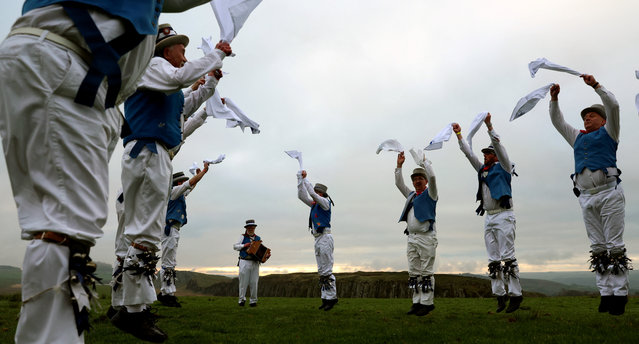 Members of Hexham Morrismen perform at sunrise to traditionally mark May Day in Henshaw, Northumberland, Britain on May 1, 2023. (Photo by Lee Smith/Reuters)