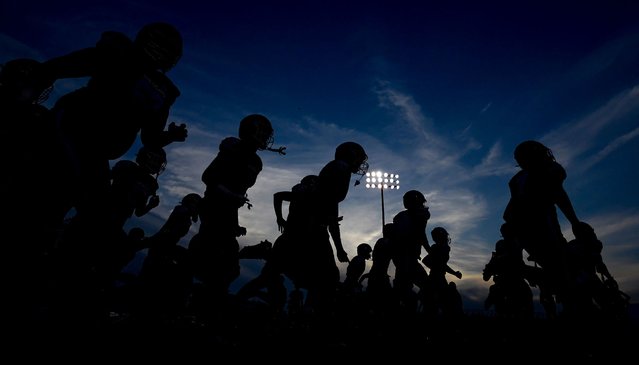 Football players from Trinity Presbyterian School take the field before a game in Mongomery, Alabama, on Friday, August 30, 2024. (Photo by Mickey Welsh/The Montgomery Advertiser/USA Today Network via Imagn)