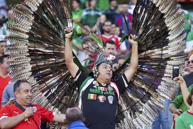 A Chilean fan and a Mexican fan cheer before a Quarterfinal match between Mexico and Chile at Levi's Stadium as part of Copa America Centenario US 2016 on June 18, 2016 in Santa Clara, California, US.  Chile won 7-0. (Photo by Brian Bahr/LatinContent/Getty Images)