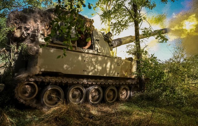 Ukrainian servicemen fire a M109 self-propelled howitzer towards Russian troops, amid Russia's attack on Ukraine, in Donetsk region, Ukraine on August 7, 2023. (Photo by Viacheslav Ratynskyi/Reuters)