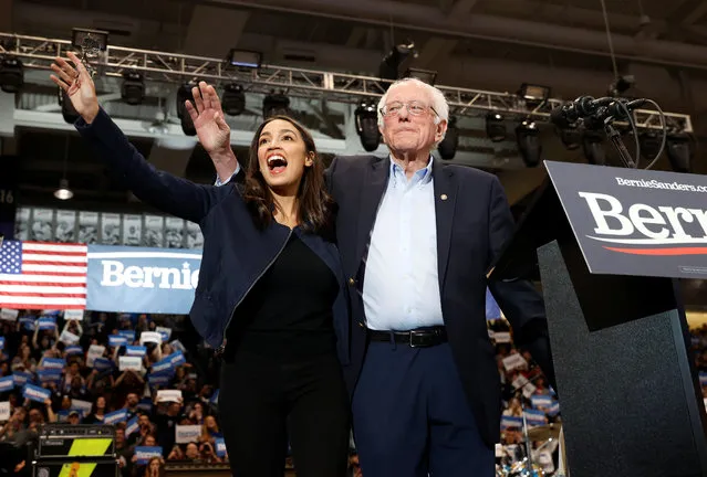 Democratic U.S. presidential candidate Senator Bernie Sanders takes the stage with U.S. Representative Alexandria Ocasio Cortez (D-NY) at a campaign rally and concert at the University of New Hampshire one day before the New Hampshire presidential primary election in Durham, New Hampshire, U.S., February 10, 2020. (Photo by Mike Segar/Reuters)
