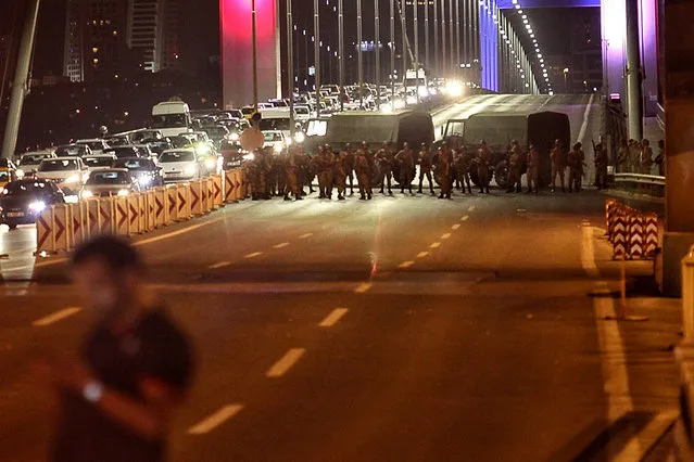 Turkish soldiers block Istanbul's Bosphorus Brigde on July 15, 2016 in Istanbul, Turkey. Istanbul's bridges across the Bosphorus, the strait separating the European and Asian sides of the city, have been closed to traffic. Reports have suggested that a group within Turkey's military have attempted to overthrow the government. Security forces have been called in as Turkey's Prime Minister Binali Yildirim denounced an “illegal action” by a military “group”, with bridges closed in Istanbul and aircraft flying low over the capital of Ankara. (Photo by Gokhan Tan/Getty Images)