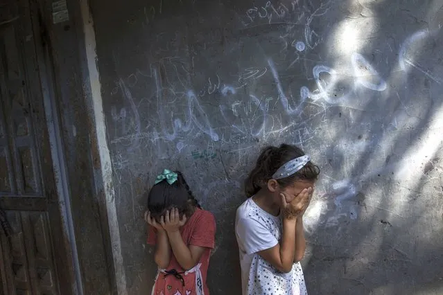 Young Palestinian girls react during the funeral of 11-year-old Layan al-Shaer in Khan Younis, in the Gaza Strip, Thursday, August 11, 2022. On Thursday, Layan died of her wounds after she was injured in last week's Israeli air strikes. (Photo by Fatima Shbair/AP Photo)