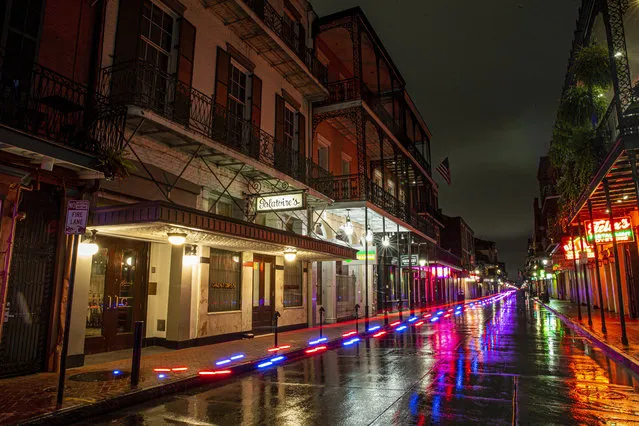 In this Friday, May 8, 2020, photo, after nearly two months of the stay-at-home coronavirus pandemic mandate, Bourbon Street in the New Orleans French Quarter is completely empty. (Photo by David Grunfeld/The Advocate via AP Photo)