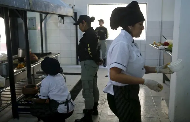 Inmates cook food during a culinary competition at the Santa Monica female prison in Lima, September 10, 2015. (Photo by Mariana Bazo/Reuters)