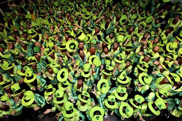 A crowd of 262 people dressed as Leprechauns gather at the Canal Theatre to break the Guinness World Record in Dublin November 16, 2011. Irish leprechauns, tea-sipping Britons, Australian ABBA impersonators and the oldest yoga teacher on the planet were just some of the people setting world records on Thursday. More than 300,000 people around the world took part in the seventh annual Guinness World Records Day. (Photo by Maxwell Photography/Guinness World Records)