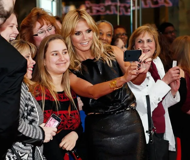 Model and media personality Heidi Klum takes selfies with fans at the “America's Got Talent” red carpet event at Madison Square Garden on April 4, 2014 in New York City. (Photo by Jemal Countess/Getty Images)