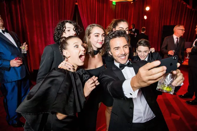 In this handout photo provided by Netflix,  Millie Bobby Brown, Finn Wolfhard, Shawn Levy and Noah Schnapp attend the Netflix Golden Globes after party at Waldorf Astoria Beverly Hills on January 7, 2018 in Beverly Hills, California. (Photo by Netflix via Getty Images)