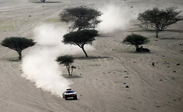 Audi's hybrid Spanish drivers Carlos Sainz of Spain and co-driver Lucas Cruz of Spain compete during Stage 1 of the Dakar 2023 around Sea Camp by the Red Sea in Yanbu, Saudi Arabia, on January 1, 2023. (Photo by Franck Fife/AFP Photo)