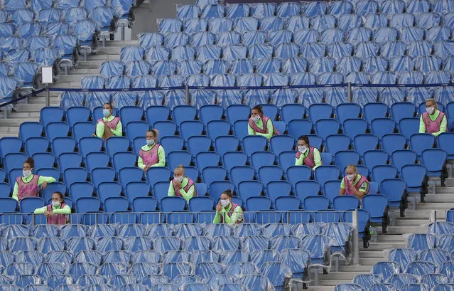 Wolfsburg players sit in the stands during the Women's Champions League final soccer match between Wolfsburg and Lyon at the Anoeta stadium in San Sebastian, Spain, Sunday, August 30, 2020. (Photo by Villar Lopez/Pool via AP Photo)