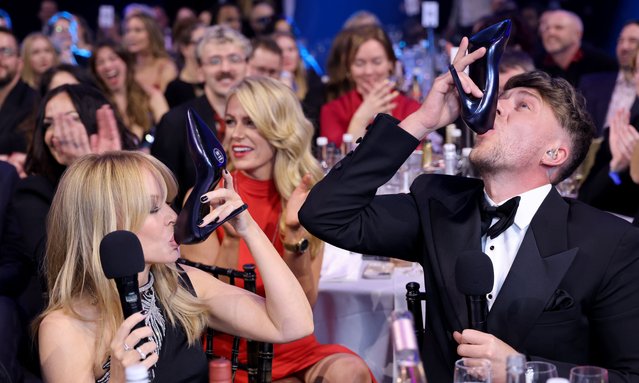Australian singer-songwriter Kylie Minogue and British radio host and television personality Roman Kemp during the BRIT Awards 2024 at The O2 Arena on March 02, 2024 in London, England. (Photo by JMEnternational/Getty Images)