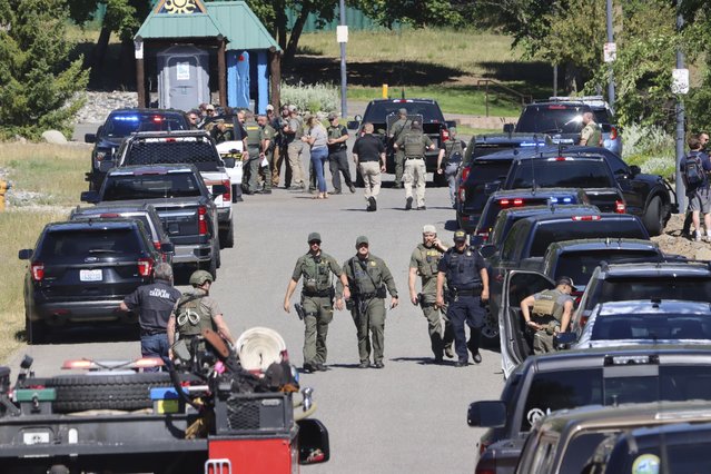 Law enforcement and emergency responders at Cherry Hill Park off 15th Street on Sunday afternoon, June 29, 2025, following reports of an ambush shooting attack on Canfield Mountain, in Coeur d'Alene, Idaho. (Photo by Bill Buley/Coeur D'Alene Press via AP Photo)