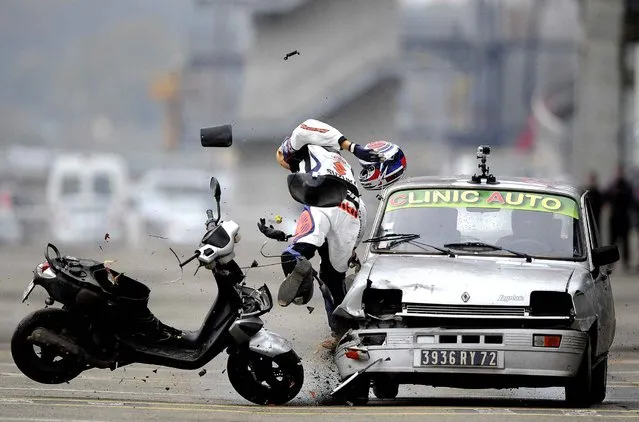 A car driving at 70 km/h hits a dummy on a scooter in Le Mans, north-western France, on November 20, 2014, during a crash test organized to raise awareness among high school students of the risks of road traffic. (Photo by Jean-Francois Monier/AFP Photo)
