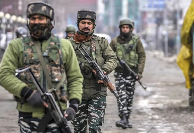 Indian soldiers patrol a closed market on Republic Day in Srinagar, Indian controlled Kashmir, Thursday, January 26 , 2023. The day marks the anniversary of the adoption of the country’s constitution on Jan. 26, 1950, nearly three years after it won independence from British colonial rule. (Photo by Mukhtar Khan/AP Photo)