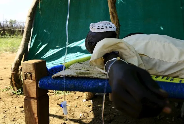 A man receives treatment during visit by a European Union delegation, at an IDP camp in Azaza, east of Ad Damazin, capital of Blue Nile state, October 21, 2015. (Photo by Mohamed Nureldin Abdallah/Reuters)