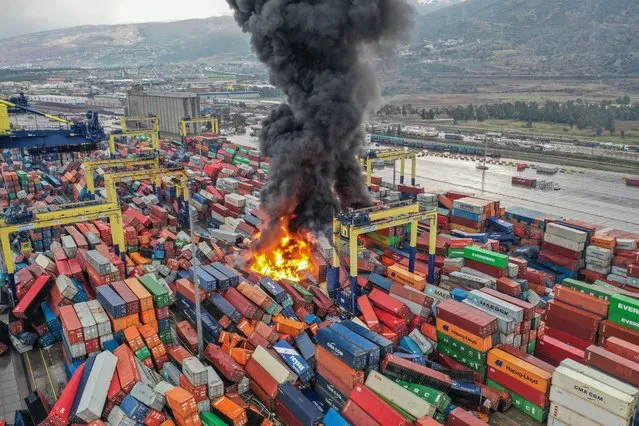 An aerial view of the fire in overturned containers during the earthquakes in Hatay, Turkiye after 7.7 and 7.6 magnitude earthquakes hits Turkiye's Kahramanmaras, on February 06, 2023. Disaster and Emergency Management Authority (AFAD) of Turkiye said the 7.7 magnitude quake struck at 4.17 a.m. (0117GMT) and was centered in the Pazarcik district and 7.6 magnitude quake struck in Elbistan district in the province of Kahramanmaras in the south of Turkiye. Gaziantep, Sanliurfa, Diyarbakir, Adana, Adiyaman, Malatya, Osmaniye, Hatay, and Kilis provinces are heavily affected by the earthquakes. (Photo by Murat Sengul/Anadolu Agency via Getty Images)
