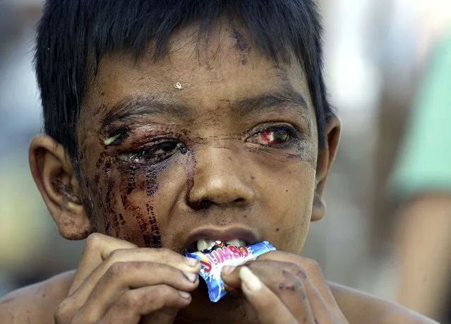 An Acehnese child who survived a tsunami eats a sweet at a military hospital in the Indonesian city of Banda Aceh in this January 20, 2005 file photo. (Photo by Reuters/Stringer)