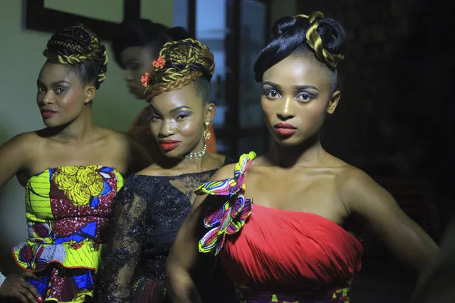 In this photo taken Saturday December 23, 2017, Models Poses back stage for a photograph before a fashion show in Beni Eastern Congo . Young Congolese designer Miki Sikabwe has trained in Rwanda, Burundi and Kenya, but hasn't gotten the chance to show her work locally in eastern Congo for years because of insecurity. (Photo by Al-Hadji Kudra Maliro/AP Photo)