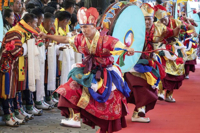 Tibetan exiles with ceremonial drums welcome their spiritual leader the Dalai Lama, unseen, as he arrives to preside over an event during which devotees prayed for his longevity in Dharamshala, India, Wednesday, September 10, 2025. (Photo by Ashwini Bhatia/AP Photo)