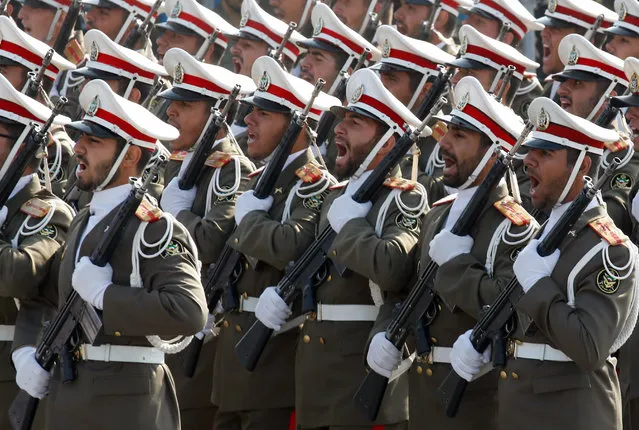 Iranian army soldiers march during a military parade marking the annual National Army Day in Tehran, Iran, 18 April 2018. Media reported that following the recent development in the region Rouhani said that Iran did not want tension but if necessary, the Iranian forces would be prepared to defend the countrie's borders. (Photo by Abedin Taherkenareh/EPA/EFE)