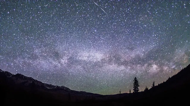 This June 4, 2016 photo provided by Nils Ribi Photography shows the Milky Way in the night sky at the foot of the Boulder Mountains in the Sawtooth National Recreation Area, Idaho. Tourists heading to central Idaho will be in the dark if local officials get their way. The nation's first International Dark Sky Reserve will fill a chunk of the sparsely populated region containing night skies so pristine that interstellar dust clouds are visible in the Milky Way. (Photo by Nils Ribi Photography via AP Photo)