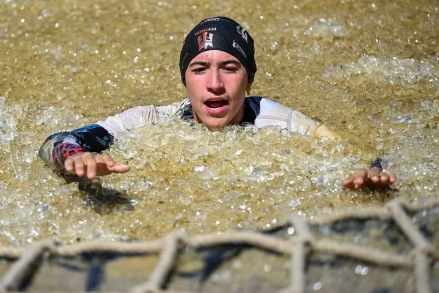 Competitors take part in “Tough Mudder” at the Glen Helen Raceway in San Bernardino, California, United States on April 2, 2023. (Photo by Tayfun Coskun/Anadolu Agency via Getty Images)