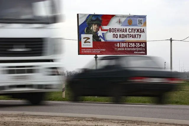 A billboard advertising “Contract military service” is seen beside a highway outside Krasnodar, Russia, Thursday, March 23, 2023. (Photo by AP Photo/Stringer)