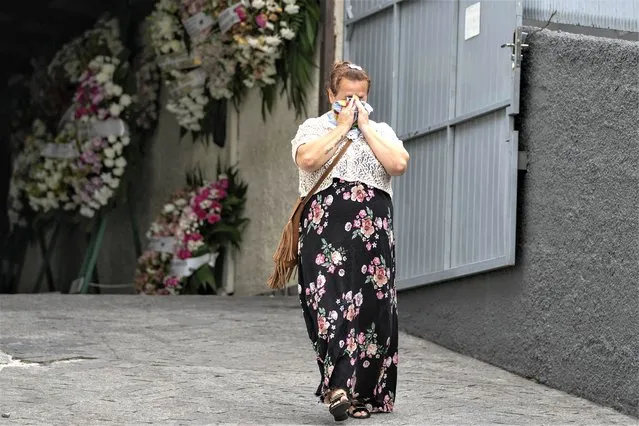 A woman greives during the funeral of seven-year-old Larissa Maia Toldo, who was killed by a man with a hatchet inside a day care center, at the Sao Jose cemetery, in Blumenau, Santa Catarina state, Brazil, April 6, 2023. Brazil is grappling with a wave of violence in its schools. The government has sought input from independent researchers and convened a meeting on Tuesday, April 18, 2023, of ministers, mayors and Supreme Court justices to discuss possible solutions.  (Photo by Andre Penner/AP Photo)