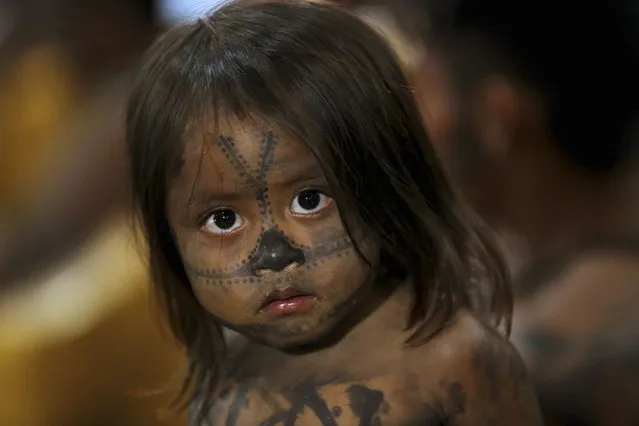 A Munduruku Indian child is pictured at the Planalto Palace, where a meeting with Minister of the General Secretariat of the Presidency of Brazil Gilberto Carvalho was being held with other Munduruku Indians, in Brasilia, June 4, 2013. (Photo by Ueslei Marcelino/Reuters)