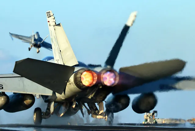 A US Navy F/A-18F Super Hornet launches from the flight deck of aircraft carrier USS Nimitz. (Photo by Stocktrek Images/Getty Images)