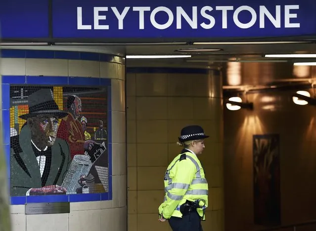 A police officer stands on duty outside Leytonstone Underground station in east London, December 7, 2015. British detectives have charged a man with attempted murder after a knife attack at Leytonstone station on Saturday night which was described by police as a terrorist incident. Police said 29-year-old Muhaydin Mire of east London would appear at Westminster Magistrates' Court later on Monday. (Photo by Toby Melville/Reuters)