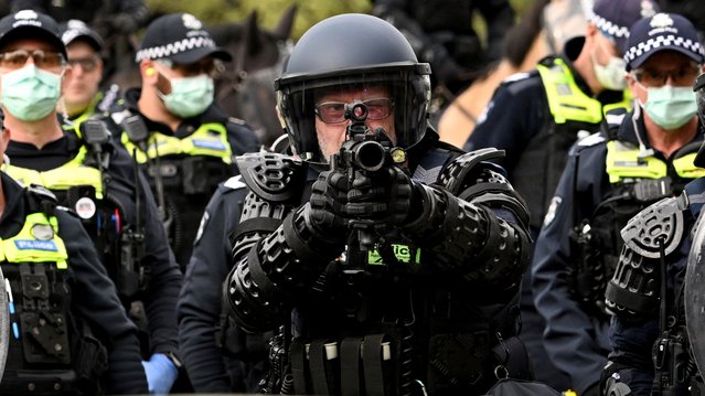 Protesters confront police outside the Land Forces 2024 arms fair in Melbourne on September 11, 2024. (Photo by William West/AFP Photo)