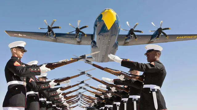 U.S. Marines of the Silent Drill Platoon, Marine Barracks Washington, execute their “meat grinder” sequence during the Blue Angels’ “Fat Albert” C-130J Super Hercules fly-over at Marine Corps Air Station (MCAS) Yuma, Arizona on February 28, 2023. The Silent Drill Platoon and the Blue Angels flight crew held a photoshoot on the MCAS Yuma runway. (Photo by LCpl. Jade Venegas/U.S. Marine Corps/CMA Capture Media Agency)