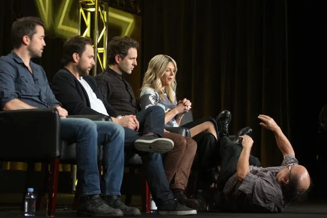 Cast member Danny DeVito falls to the floor in comedic response to a question as his fellow cast look on during the “It's Always Sunny in Philadelphia” panel at the Television Critics Association (TCA) Winter Press Tour in Pasadena, California January 18, 2015. From L-R: Rob McElhenney, Charlie Day, Glenn Howerton and Kaitlin Olson. (Photo by David McNew/Reuters)