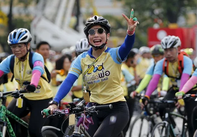 Thailand's Princess Sirivannavari Nariratana waves to crowd as she cycles in the “Bike for Dad” event in Bangkok, Thailand, December 11, 2015. Thai Crown Prince Maha Vajiralongkorn led thousand of cyclists on a 29-km course in Bangkok to celebrate King Bhumibol Adulyadej's 88th birthday which fell on December 5. (Photo by Chaiwat Subprasom/Reuters)