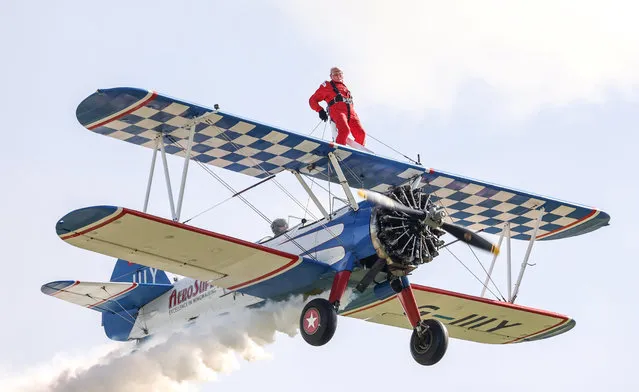 Ivor Button, 95, took to the skies strapped to the top of a plane after taking off from Rencombe Airfield in Glos, UK on April 9, 2022. He has now beaten a world record for oldest wing walker set by the late Tom Lackey – who was 93 when he did it in 2013. (Photo by Tom Wren/South West News Service)
