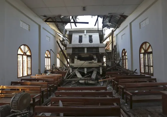 The interior view of a damaged church is seen after an earthquake at Leimakhong village on the outskirts of Imphal, India, January 4, 2016. A powerful earthquake struck northeastern India before dawn on Monday, killing at least four people and injuring nearly 100, though the toll was expected to rise, with rescue efforts hampered by severed power supplies and telecommunication links. (Photo by Reuters/Stringer)