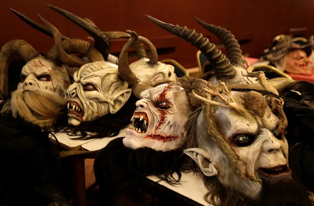 Masks of the devil lies on a table before a Krampus show, the traditional parade where people in costumes and masks perform an old ritual to disperse the ghosts of winter, in the southern Bohemian town of Kaplice, December 10, 2016. (Photo by David W. Cerny/Reuters)