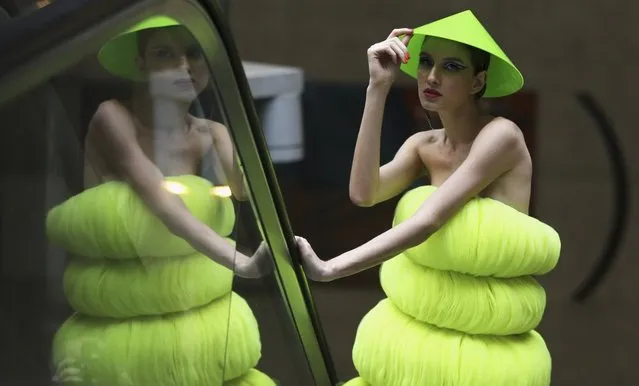 A model presents a creation in a subway station during the Sao Paulo Fashion Week in Sao Paulo October 27, 2013. (Photo by Paulo Whitaker/Reuters)