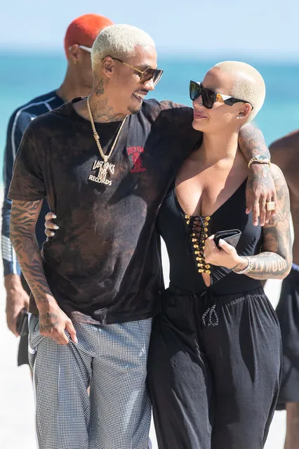 Amber Rose and new beau Alexander Edwards hold hands and are smiling as the leave the beach together in Miami Beach, Florida on October 28, 2018. (Photo by LTUS2/Splash News and Pictures)